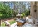 Inviting covered patio with comfortable seating and a beautiful view of the lush backyard at 8904 Milden Hall Ct, Raleigh, NC 27615