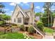Brick home featuring a walk-out basement, an outdoor patio area and a well-maintained yard at 8904 Milden Hall Ct, Raleigh, NC 27615