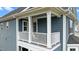 View of the balcony from outside the home, including a railing and supporting columns at 8925 Lee Brown Ridge Dr, Wake Forest, NC 27587