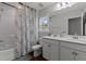 Well-lit bathroom featuring a double sink vanity with updated hardware, a stylish mirror, and a shower-tub combination at 8925 Lee Brown Ridge Dr, Wake Forest, NC 27587