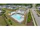 Aerial view of a community pool surrounded by lush greenery and neighborhood amenities in a quiet residential area at 8925 Lee Brown Ridge Dr, Wake Forest, NC 27587