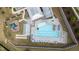 Aerial view of a community pool with lounge chairs, playground, and recreation areas at 8925 Lee Brown Ridge Dr, Wake Forest, NC 27587
