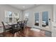 Cozy dining area with lots of natural light from the windows and access to an outdoor patio at 8925 Lee Brown Ridge Dr, Wake Forest, NC 27587