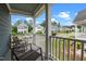 Inviting front porch with comfortable seating, offering a pleasant view of the neighborhood street and well-manicured lawns at 8925 Lee Brown Ridge Dr, Wake Forest, NC 27587