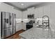 Spacious kitchen showcasing stainless steel appliances, granite countertops, and ample storage at 8925 Lee Brown Ridge Dr, Wake Forest, NC 27587
