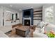Comfortable living room featuring a fireplace, built-in shelving, and hardwood floors at 8925 Lee Brown Ridge Dr, Wake Forest, NC 27587