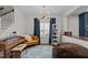 Cozy living room featuring hardwood floors, and a unique light fixture at 8925 Lee Brown Ridge Dr, Wake Forest, NC 27587