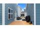Outdoor patio with wicker furniture and a grill, perfect for relaxing or entertaining in a private outdoor setting at 8925 Lee Brown Ridge Dr, Wake Forest, NC 27587