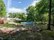 Backyard features a pool, patio area, and lush greenery at 924 Magnolia Ridge Way, Fuquay Varina, NC 27526