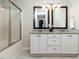 Bathroom featuring a shower-tub, granite counters and double framed mirrors at 924 Magnolia Ridge Way, Fuquay Varina, NC 27526