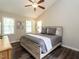 Tranquil bedroom with high ceilings, neutral walls, hardwood floors, and natural light at 924 Magnolia Ridge Way, Fuquay Varina, NC 27526