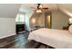 Spacious bedroom featuring a fireplace, wood floors and natural light from window at 924 Magnolia Ridge Way, Fuquay Varina, NC 27526