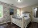 Bedroom boasts an accent wall, wood floors, and natural light from windows at 924 Magnolia Ridge Way, Fuquay Varina, NC 27526