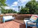 Outdoor deck with cozy seating overlooking the property at 924 Magnolia Ridge Way, Fuquay Varina, NC 27526