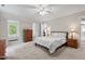 Bright bedroom with a window seat, carpet floors, and a ceiling fan at 9900 Two Robins Ct, Raleigh, NC 27613