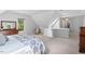 Expansive bedroom featuring an ensuite sitting area, neutral carpet, and natural light, creating a serene retreat at 9900 Two Robins Ct, Raleigh, NC 27613