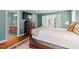 Stylish bedroom with hardwood floors and an en-suite bathroom at 9900 Two Robins Ct, Raleigh, NC 27613