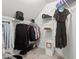 Spacious walk-in closet with carpet flooring and white shelving at 9900 Two Robins Ct, Raleigh, NC 27613