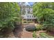 Beautiful two-story home featuring a covered front porch and well-maintained landscaping at 9900 Two Robins Ct, Raleigh, NC 27613