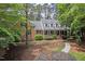 Charming brick home featuring a welcoming front porch and meticulously maintained landscaping at 9900 Two Robins Ct, Raleigh, NC 27613