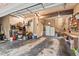 Open garage interior with ample storage, workbench, and shelving at 9900 Two Robins Ct, Raleigh, NC 27613