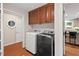 Laundry room with washer and dryer hookups and tile floors at 9900 Two Robins Ct, Raleigh, NC 27613