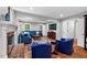 Spacious living room with hardwood floors, fireplace, and blue sectional sofa at 9900 Two Robins Ct, Raleigh, NC 27613