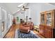 Light-filled living room features hardwood floors, vaulted ceilings, and comfortable seating area at 9900 Two Robins Ct, Raleigh, NC 27613