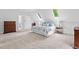 Spacious bedroom with vaulted ceilings, skylights, and neutral carpet at 9900 Two Robins Ct, Raleigh, NC 27613