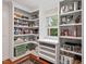 Spacious pantry with ample shelving and colorful decor at 9900 Two Robins Ct, Raleigh, NC 27613