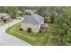 Aerial view of a two-story home showcasing the backyard, deck, and surrounding landscape at 10 Stillwood Ct, Clayton, NC 27520