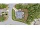 Aerial view of a home's roof and surrounding yard with a neighborhood street nearby at 10 Stillwood Ct, Clayton, NC 27520