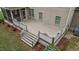 Open-air back deck offers a peaceful outdoor space with stairs leading to the yard at 10 Stillwood Ct, Clayton, NC 27520