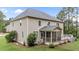 Back exterior view of a home featuring a screened in porch and open-air deck at 10 Stillwood Ct, Clayton, NC 27520
