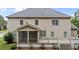 Home's back exterior with screened in porch and open-air deck offers backyard enjoyment at 10 Stillwood Ct, Clayton, NC 27520