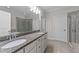 Bathroom featuring double vanity, granite countertop, tub, and separate shower at 10 Stillwood Ct, Clayton, NC 27520