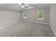 Spacious bedroom with tray ceiling, carpet floors and bright windows at 10 Stillwood Ct, Clayton, NC 27520