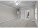 Spacious bedroom with a ceiling fan, plush carpet, and neutral paint, creating a cozy atmosphere at 10 Stillwood Ct, Clayton, NC 27520