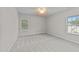Bright bedroom with soft carpet, neutral walls, and natural light from two windows at 10 Stillwood Ct, Clayton, NC 27520