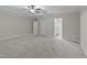 Large bedroom with tray ceiling, carpet floors and ensuite bath at 10 Stillwood Ct, Clayton, NC 27520