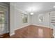Bright dining area with hardwood floors, large windows, and backyard access at 10 Stillwood Ct, Clayton, NC 27520