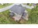 Rear exterior of home featuring a deck, screened porch, and neatly maintained yard at 10 Stillwood Ct, Clayton, NC 27520