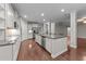Open-concept kitchen featuring stainless steel appliances and center island at 10 Stillwood Ct, Clayton, NC 27520