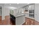 Modern kitchen with large island, stainless appliances, and granite countertops at 10 Stillwood Ct, Clayton, NC 27520