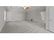 Spacious carpeted main bedroom featuring tray ceiling, creating a relaxing retreat at 10 Stillwood Ct, Clayton, NC 27520
