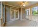 Cozy screened porch with wood flooring, ceiling fan and access to backyard at 10 Stillwood Ct, Clayton, NC 27520