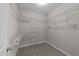 Carpeted walk-in closet with wire shelving for organized storage and easy access at 10 Stillwood Ct, Clayton, NC 27520
