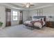 Spacious main bedroom with tray ceiling, ample natural light, and stylish furnishings at 100 Cordoba Dr, Franklinton, NC 27525