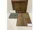 Showcasing cabinet door, flooring, countertop and backsplash samples for a modern home design at 100 Cordoba Dr, Franklinton, NC 27525