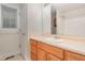Bathroom featuring a tub and shower combo, tile floors, and wood cabinets at 1000 Strobus Ct, Wendell, NC 27591